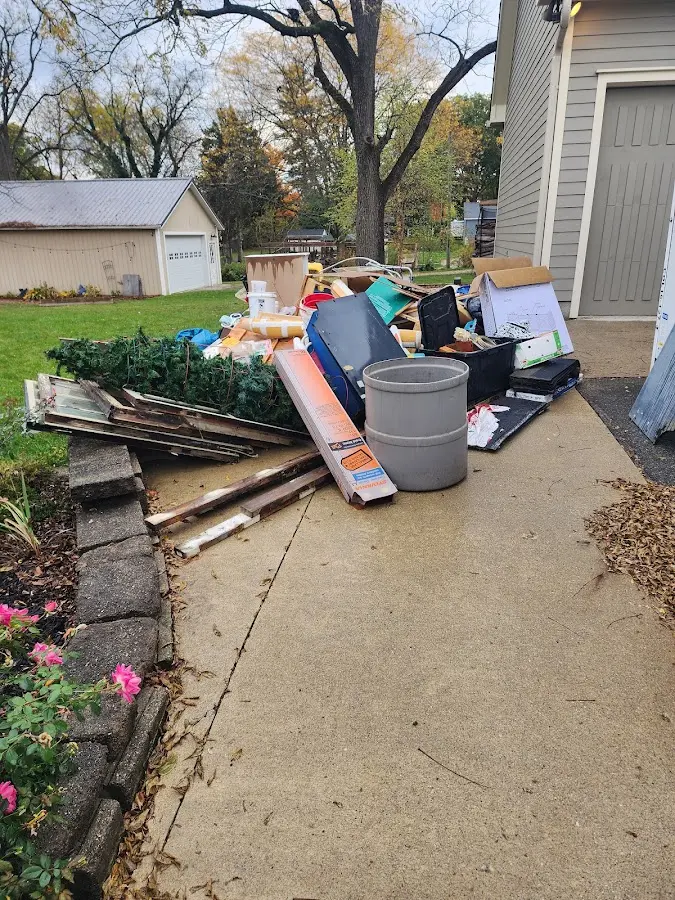 Dumpster being loaded with debris for Residential Dumpster Rental in Carver